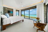The sea villas' impact-resistant sliding glass doors allow for easy indoor/outdoor living.  Photo 9 of 12 in An Eco-Minded Resort in the Bahamas Lists for $2.95M