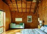 The owners purchased the double chaise from ABC Carpet & Home for the downstairs living area, but it didn’t quite fit—so it lives in the corner of their bedroom.