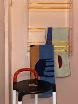 Antonio designed and made the Perspex towel rack in the bathroom when he couldn't find one that suited the space. The Polo stool by Anna Castelli Ferrieri for Kartell is from Bi-Rite Studio in Brooklyn.
