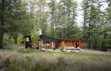 Maine-based Whitten Architects built this two-bedroom family cabin on a quiet lake in New Hampshire. "Metaphorically, the cabin’s exterior is like a cut log," says architect Tom Lane. "The black-stained Western red cedar is the bark, and the Douglas fir siding under cover is the exposed wood once the log has been cut."&nbsp;