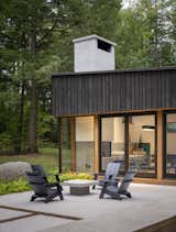 The owners built the house as a place to gather with their three adult children on Loon Lake, where they had vacationed at the husband’s family home for years. The modern Adirondack chairs are by Loll Designs.