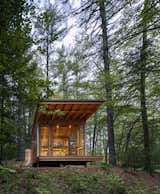 The detached screened porch sits out in the landscape, not unlike a Japanese teahouse.