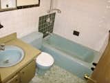 The team demolished the powder blue bath on the first floor and added a new bath in the basement.