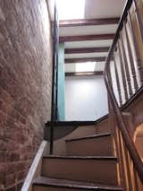 The team plastered over the home's exposed brick walls.