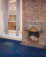 The team refurbished the chimney in the front portion of the house because Priscilla really wanted a fireplace.