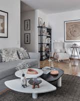 The coffee table is a copy of a 1980s design. The vase is by Olga Fradina as are the black and white abstract prints in the hall.  Photo 9 of 17 in Midcentury and ’80s Finds Transform a Rental in Switzerland Into a Fabulous Family Home