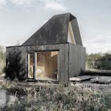 The studio serves as a place for Thomas to paint as well as a guest house. “The height and width are the same so it feels very spacious,” Thomas says of the 215-square foot structure. The couple stretch after runs on the circular deck in the foreground, and Louise practices yoga there.