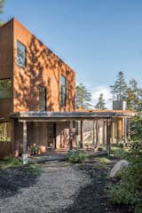 Shaw and the clients talked a lot about materials and how they would weather. “As Cor-Ten ages, it darkens to the color of the pine needs on the forest floor so the building will recede into the site,” Shaw says.
