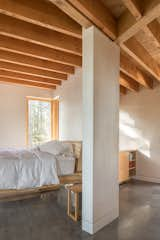 A partition creates a nook for the bed in the grandparents’ cabin. 