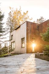 Mid-Coast Maine Camp by Winkelman Architecture primary bedroom cabin exterior