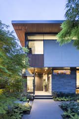Exterior, House Building Type, Stone Siding Material, Flat RoofLine, Wood Siding Material, and Stucco Siding Material Front Entry  Photo 1 of 17 in Pacific Spirit Residence by Frits de Vries Architects + Associates  Ltd.