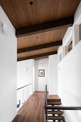 Hallway and Dark Hardwood Floor Bridge  Photo 10 of 17 in Cove Cliff Residence by Frits de Vries Architects + Associates  Ltd.