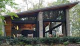 The canted roof turns at a right angle to become the rear wall.