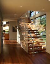 Staircase, Wood Tread, and Metal Railing Stainless steel screen at the stairway.  Photo 5 of 12 in Ave Aquatica by Robert Neylan