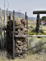A hybrid gate hung from a jumbo rock cairn