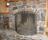 A custom fireplace that required a custom grill with elegant, slightly curved parts so light it is a joy to lift