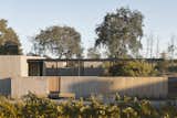 The retreat is surrounded by 5-foot high walls, high enough to promote privacy, but low enough to provide a visual connection to the natural surroundings.