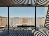 Shadow play in the courtyard, courtesy of the overhead trellis. 