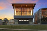 Glass wall brings the park setting into house