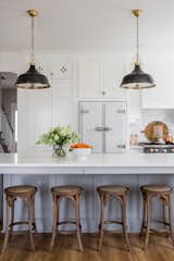 Designed with a refreshing color palette and a classic charm, Kirsten Krason's kitchen features Big Chill's Classic Fridge in White with Satin Nickel trim and Big Chill's 36" Classic Stove in Custom Basalt Gray with Brushed Brass trim.