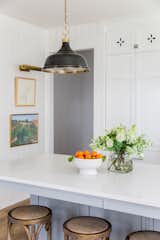 Kirsten Krason's kitchen provides an exemplary example of how white can be done right — lively, vibrant and refreshing with a little help from an accent color.