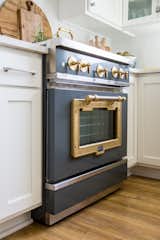 Big Chill's 36" Classic Stove in Custom Basalt Gray with Brushed Brass trim leaves a lasting impression.