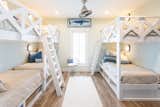 A beachy blue undercurrent continues into the home’s bedrooms, which include accommodations for those of every age.