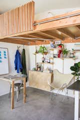 In turning her parents’ garage into an ADU, Monica and her partner donated much of their furniture, but she also deconstructed pieces they already had to adapt for the new space: Ikea bed slats make up the guardrail for the loft, for instance.