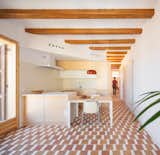 Burnt-Orange Tile Sets a Fun and Funky Tone for a Family’s Compact Barcelona Apartment