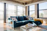 Living Room, Sectional, Medium Hardwood Floor, Coffee Tables, Sofa, and End Tables Light-filled living room  Photo 7 of 11 in Modern-Maximalist City Loft by Indigo Ink Designs