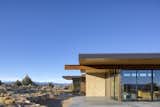 Exterior, House Building Type, Flat RoofLine, Metal Roof Material, Stone Siding Material, and Metal Siding Material Escalante Escape exterior featuring oxidized steel beam  Photo 3 of 9 in Escalante Escape by Coates Design Seattle Architects