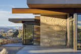 Exterior, House Building Type, Metal Siding Material, Flat RoofLine, Metal Roof Material, and Stone Siding Material Escalante Escape Exterior featuring El Dorado stone and corten steel panel cladding  Photo 4 of 9 in Escalante Escape by Coates Design Seattle Architects