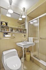 A second bath, complete with shower and vintage tile work