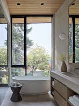 Bath Room, Pendant Lighting, Wall Lighting, Enclosed Shower, Porcelain Tile Floor, Porcelain Tile Wall, Recessed Lighting, One Piece Toilet, Drop In Sink, Freestanding Tub, and Quartzite Counter Primary Ensuite   Photo 17 of 31 in Vista House by BLA Design Group