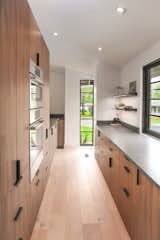 The walk-in pantry provides ample storage and an additional work space.  