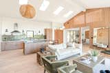 The front door, located between the kitchen and dining room, opens into the Great Room.  New Velux skylights illuminate the kitchen and flood the room with natural light all day.  Integrated appliances by Fisher Paykel blend seamlessly into the cabinetry.