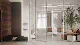 Wood, brushed steel and glass in the interior of the entrance.