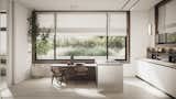 Through large windows, the modern kitchen is filled with the energy and freshness of nature.