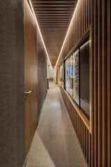 Perspective is enhanced with the walnut wooden panels. 