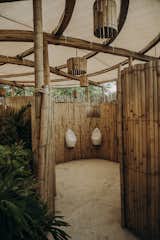 Bath Room and Ceiling Lighting Bamboo walls create privacy between restrooms  Photo 8 of 24 in Bamboo Flower _Restroom pavillion by Manu Ponte