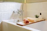 Bathrooms feature Duravit soaking tubs and fireclay tile.