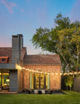 Outdoor, Horizontal Fences, Wall, Back Yard, Stone Patio, Porch, Deck, Hanging Lighting, and Wood Patio, Porch, Deck Modern Shingled Story  Photo 6 of 9 in Modern Shingled Story by Erin Sander Design