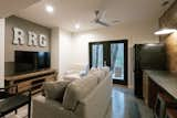 Living Room, Concrete Floor, Sofa, and Recessed Lighting  Photo 7 of 17 in Honeysuckle Bridge Cabin by Lucas Wiman