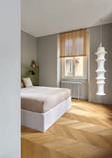 Bedroom, Lamps, Ceiling Lighting, Bed, and Medium Hardwood Floor  Photo 1 of 15 in CASA GR by KICK.OFFICE