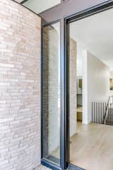 Wide plank oak flooring, white museum walls and custom steel stair railings all unify the spellbinding aura.