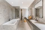 The spa master bathroom is a dance of stone, tile and fixtures that rival the best of luxury hotel suites.
