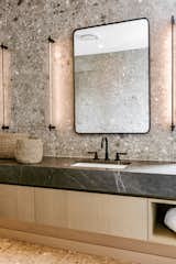 A mix of designer porcelain creates a luxurious, spa-like retreat. 