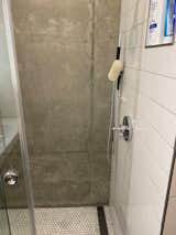 Bath Room, Engineered Quartz Counter, Two Piece Toilet, Concrete Wall, Concrete Floor, Recessed Lighting, Subway Tile Wall, and Enclosed Shower  Photo 8 of 10 in The Martinson House by scott martinson