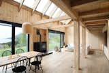 A solemn interior space achieved through the exclusive use of wood construction system, 
related to its environment  through directed views  to the Villaririca volcano and its surroundings. 
For issues of maintenance and efficiency, the PIT (Cintac) metal cover was chosen, which contrasts with the laminated pine beams and the interior paneling
