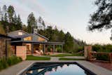 Outdoor, Large Pools, Tubs, Shower, Swimming Pools, Tubs, Shower, Grass, and Back Yard The home spills out to generous outdoor space and the pool beyond.  Photo 1 of 14 in Mark West Springs Rebuild by Richardson Pribuss Architects